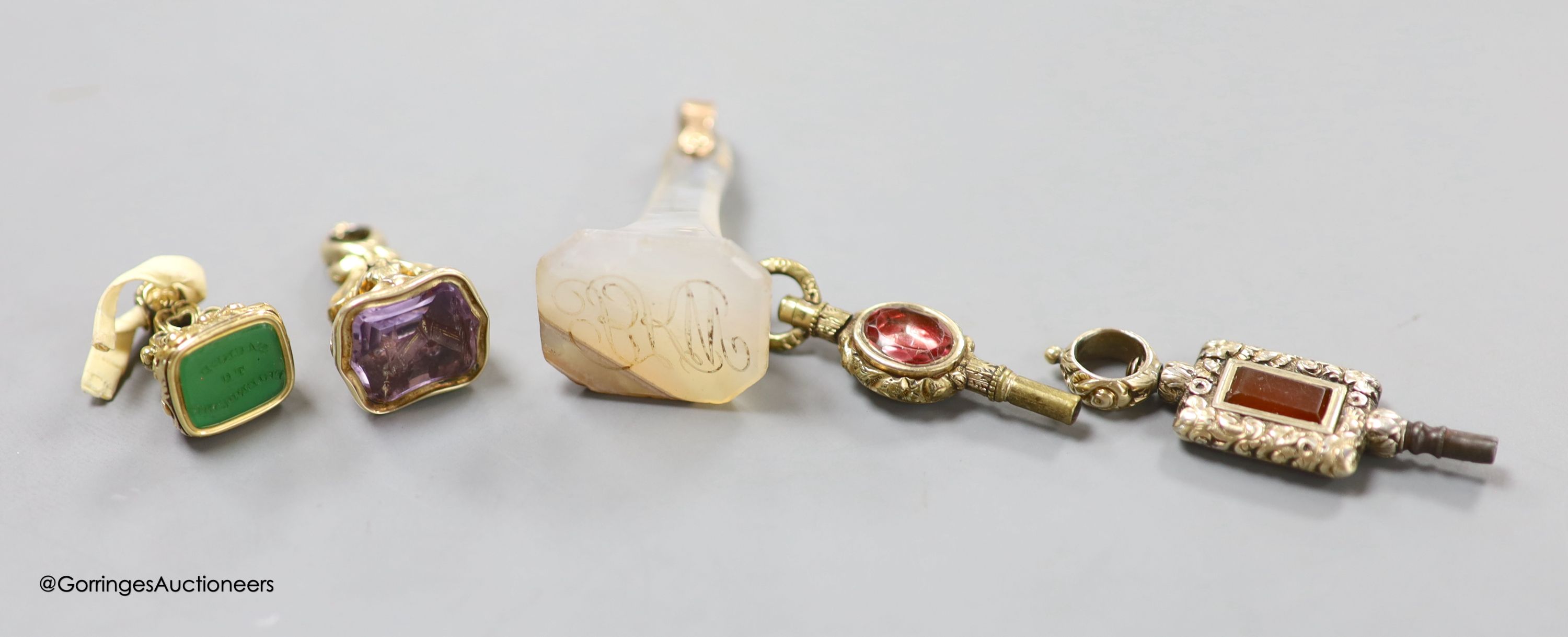 Two Victorian small yellow metal overlaid gem set fob seals, amethyst with crest matrix and chrysoprase? with inscription 'Sacred to Friendship', tallest 25mm, together with an agate fob seal with monogrammed matrix and